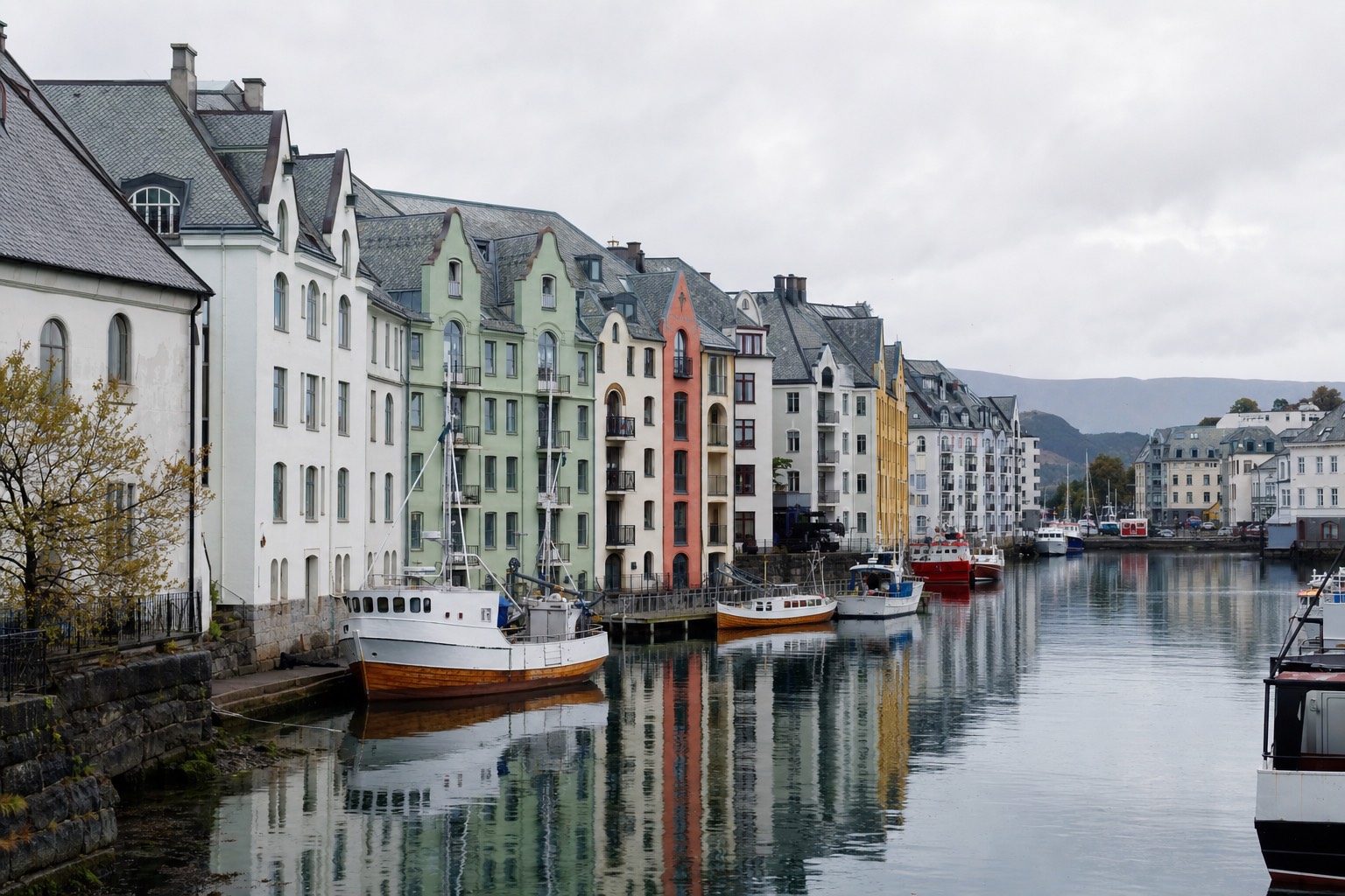Pastel Art Nouveau facades reflected in a narrow harbour canal in Alesund with fishing boats moored along the quay